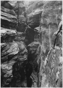 734px-View_from_east_gallery_of_Zion_Tunnel,_showing_deep_narrow_gorge_of_Pine_Creek_with_pot_holes__-_NARA_-_520447